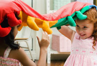 getty_rf_photo_of_two_girls_playing_with_toy.jpg